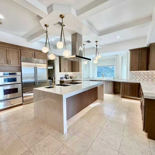 Spacious kitchen layout showcasing Willowdale cabinetry with a professional sink and open-concept window views.