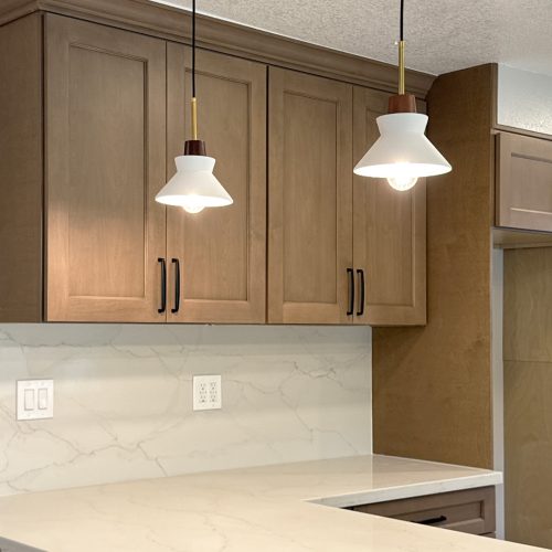 Modern kitchen featuring Willowdale CYW light-brown shaker cabinets