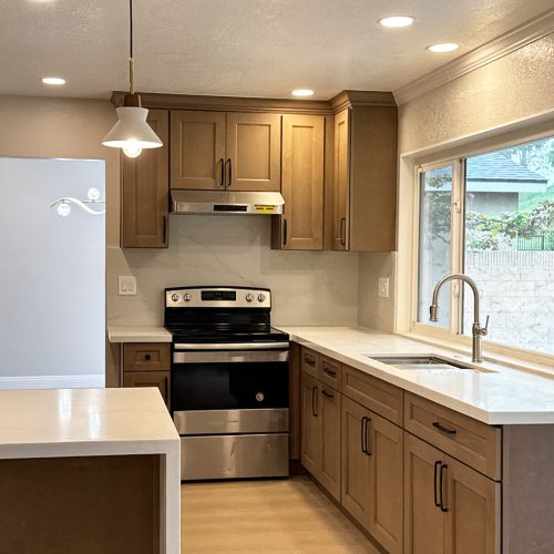 Spacious kitchen layout showcasing Willowdale cabinetry with a professional sink and open-concept window views.