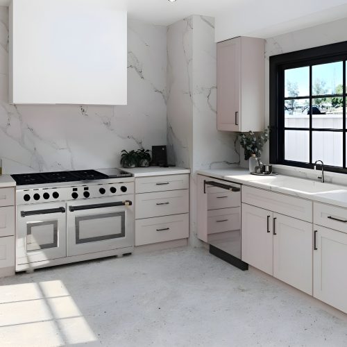 odern kitchen featuring Sand City NBS natural beige shaker cabinets, professional range, and marble backsplash.